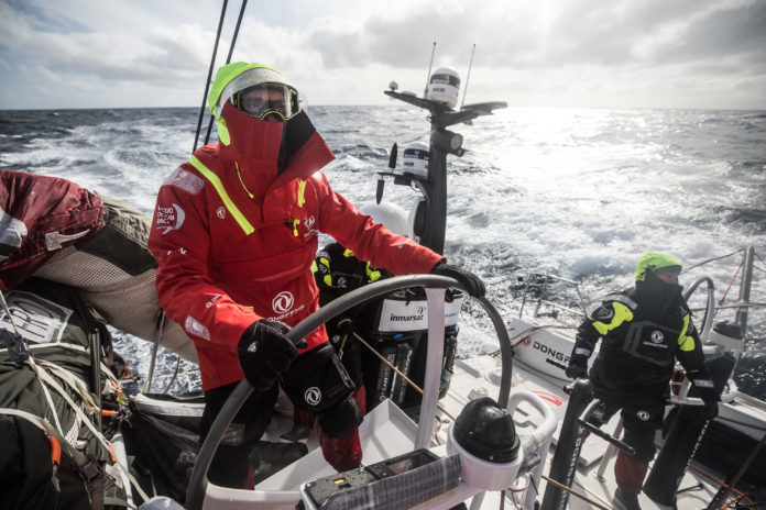 Leg 7 from Auckland to Itajai, day 07 on board Dongfeng. Jeremie Beyou helming in a cold weather. 23 March, 2018.